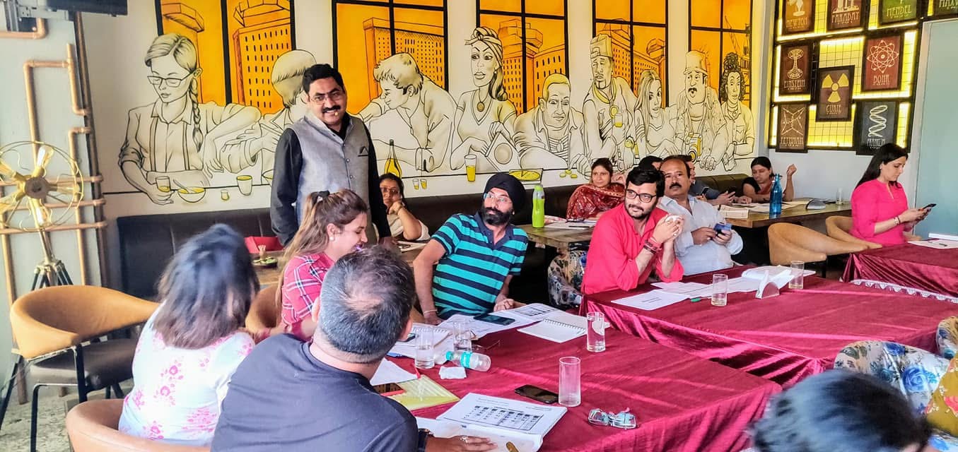 Acharya Lokesh Dhamija conducting a course